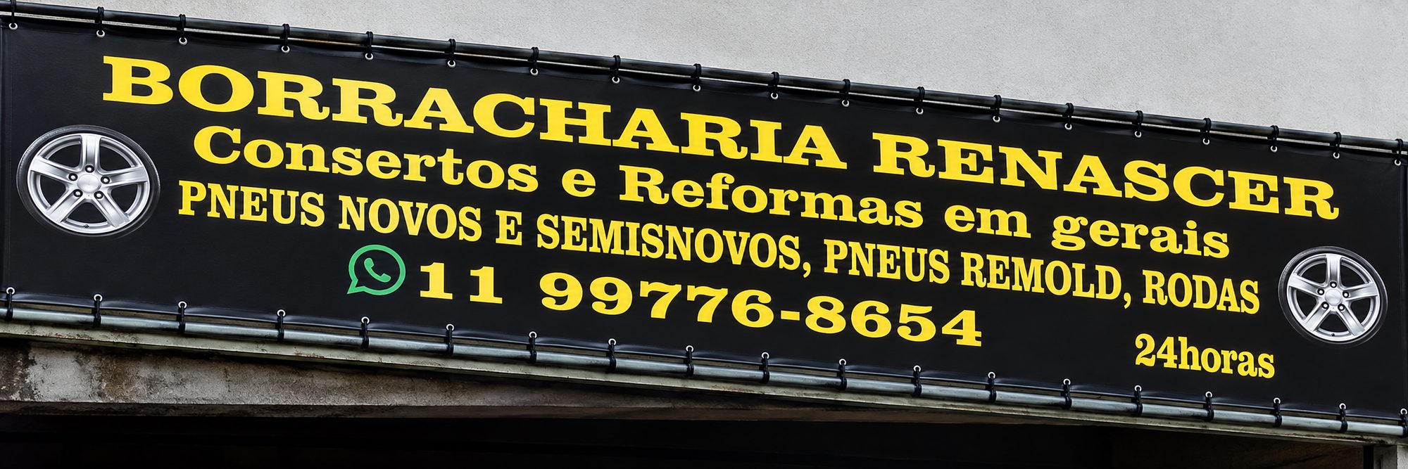 Fachada da Borracharia Renascer: faixa preta e amarela com consertos e reformas em geral, pneus novos e semisnovos, remold e rodas